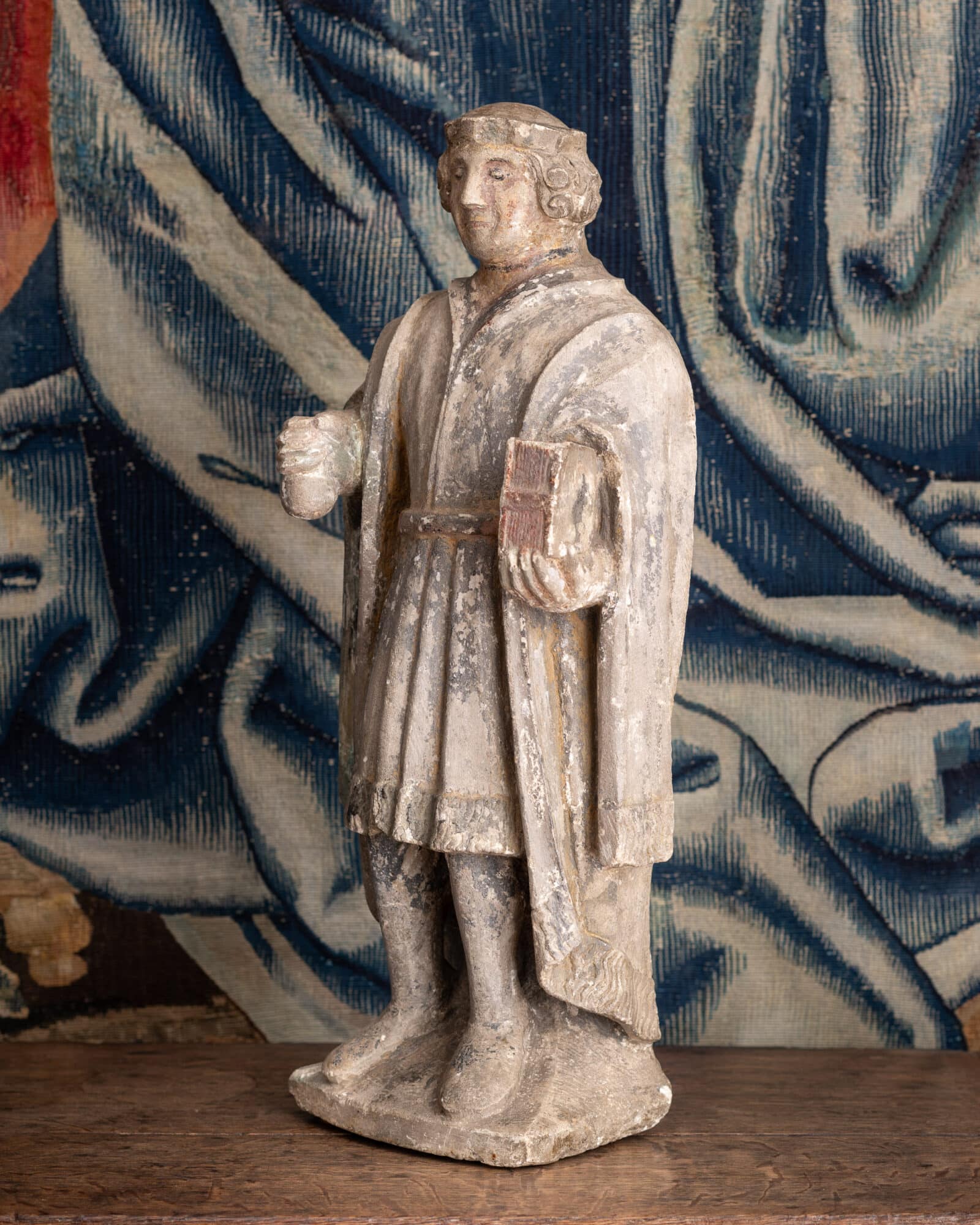 A Late Gothic Polychromed Limestone Figure of a Gentleman or Civic Dignitary