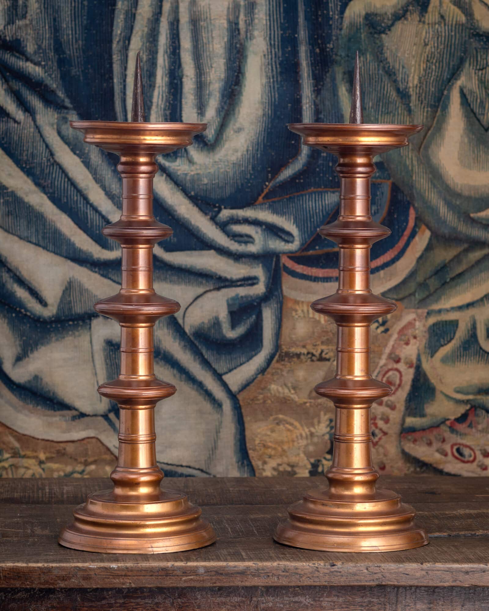 A Pair of Monumental Copper-Rich Brass Pricket Candlesticks (Scheibenleuchter)