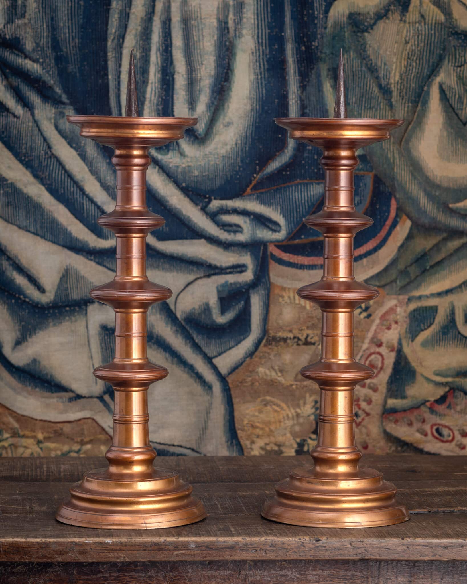 A Pair of Monumental Copper-Rich Brass Pricket Candlesticks (Scheibenleuchter)