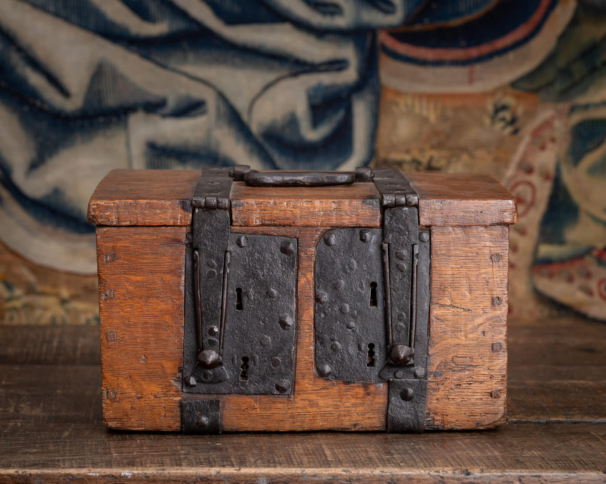 A Tudor Oak and Wrought-Iron Security Coffer with Four Keyholes