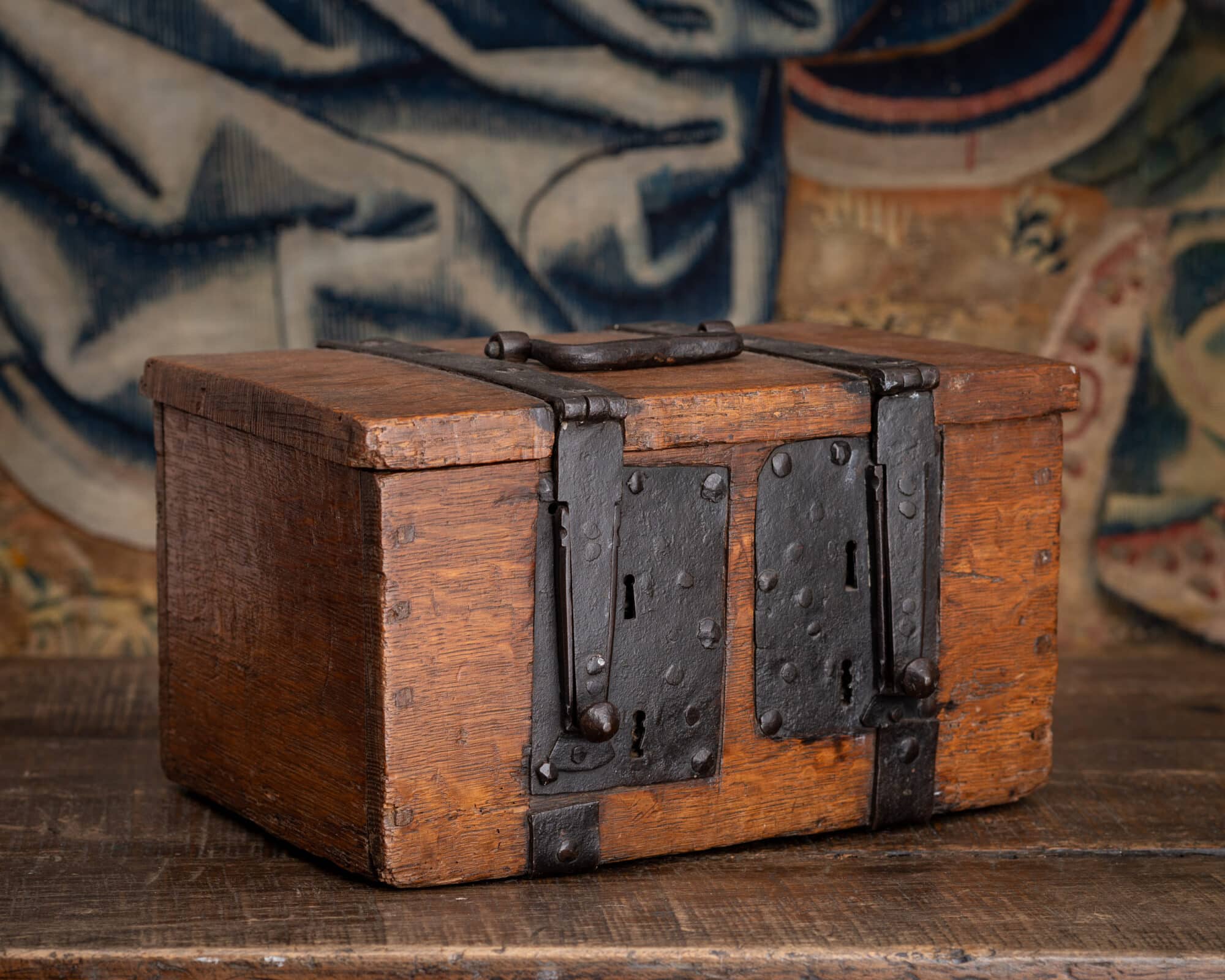 A Tudor Oak and Wrought-Iron Security Coffer with Four Keyholes