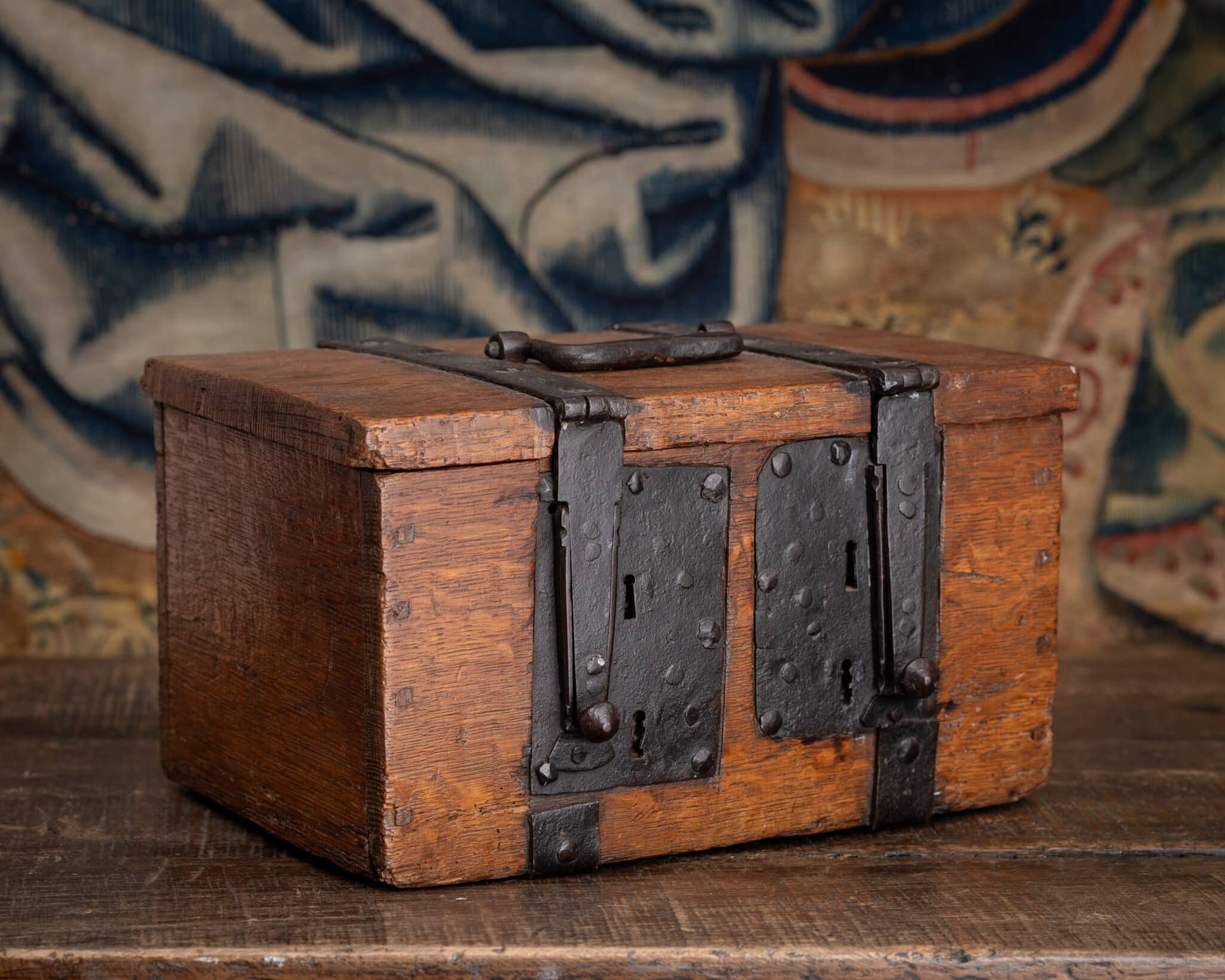 A Tudor Oak and Wrought-Iron Security Coffer with Four Keyholes