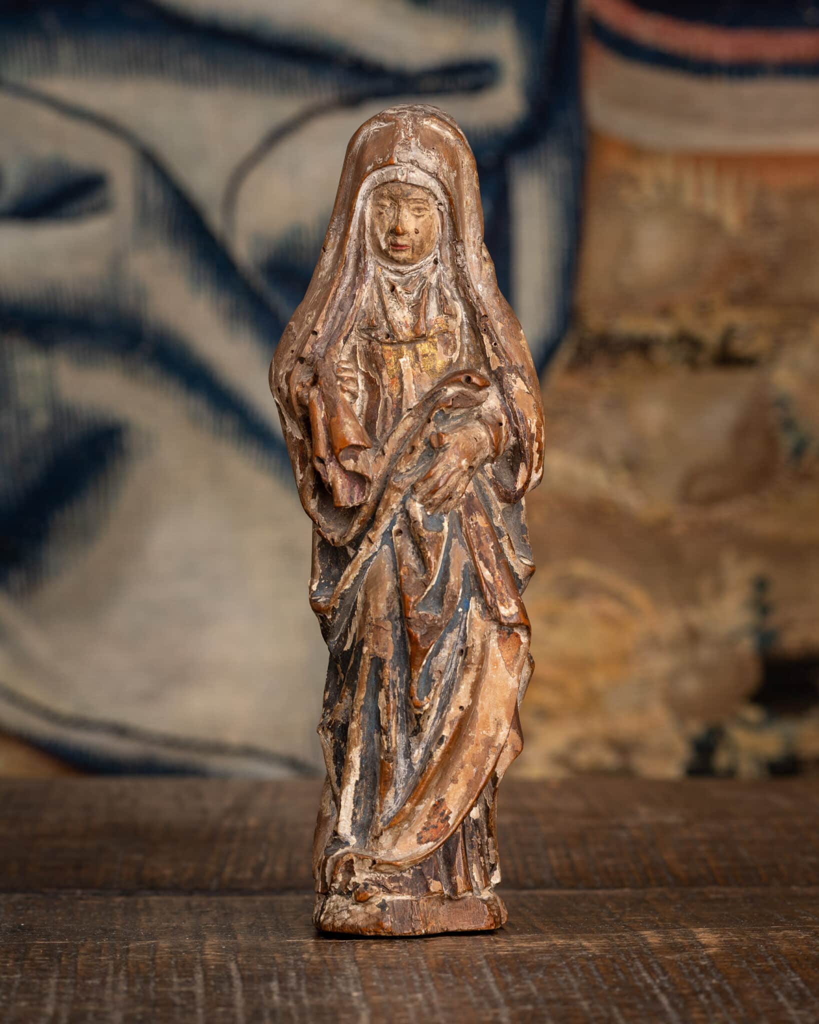 A Miniature Late Gothic Polychromed Sculpture of the Mourning Virgin