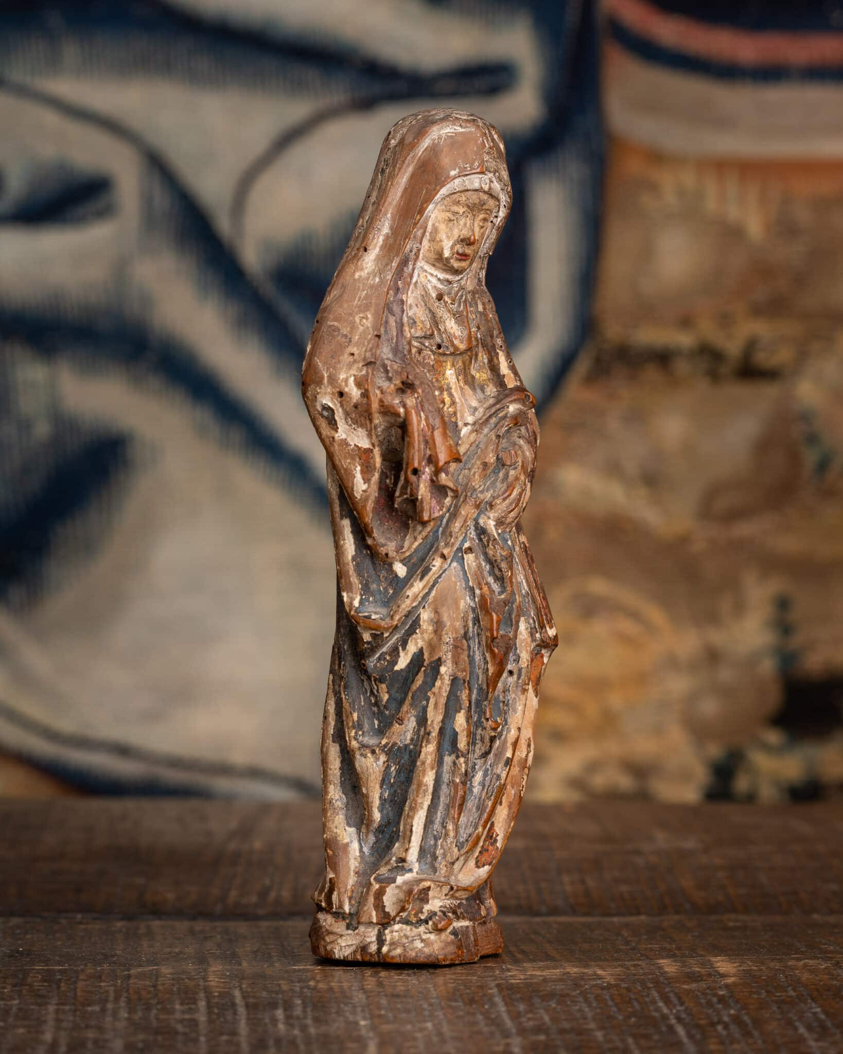 A Miniature Late Gothic Polychromed Sculpture of the Mourning Virgin