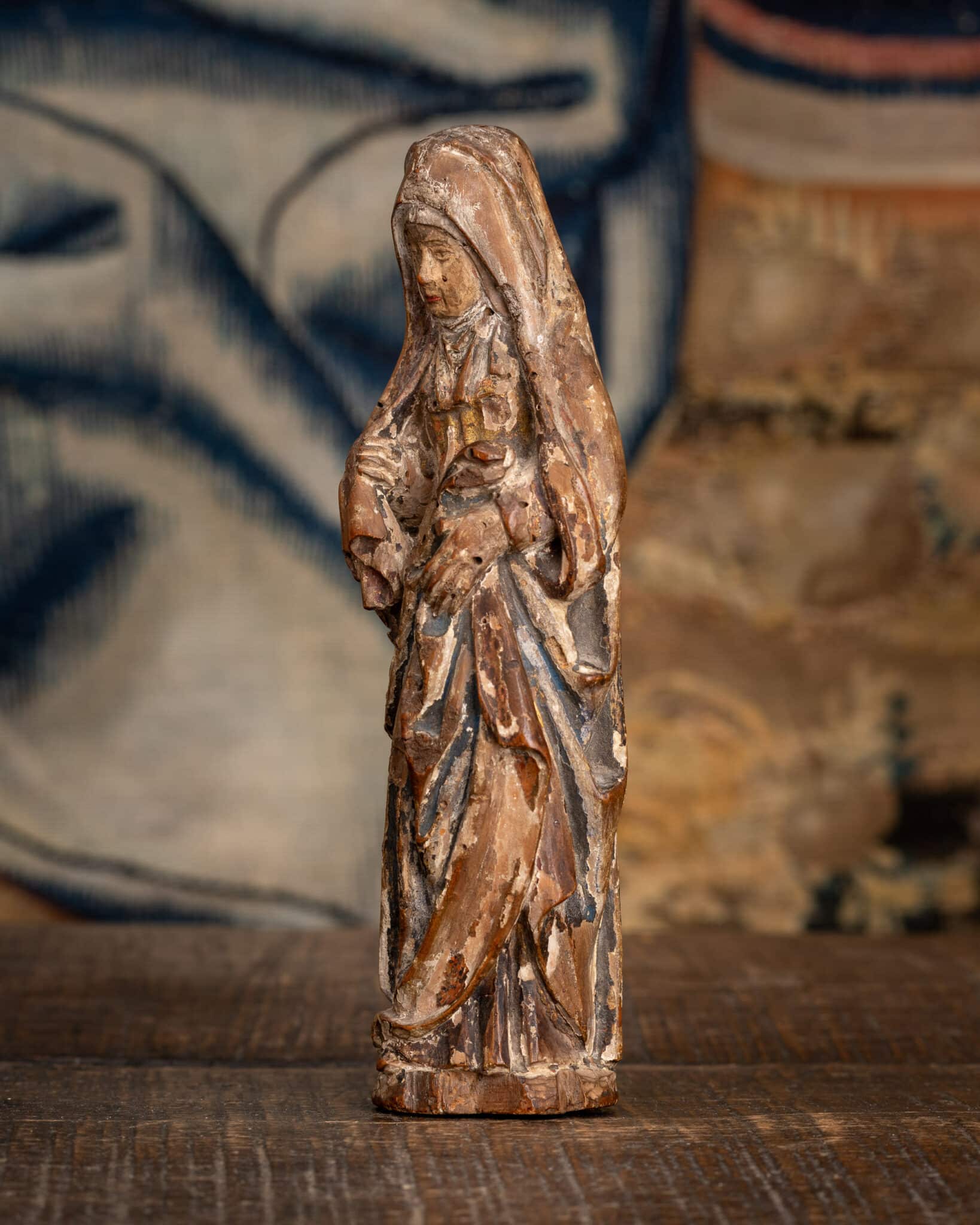 A Miniature Late Gothic Polychromed Sculpture of the Mourning Virgin